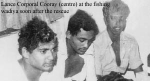 Lance Corporal Cooray (centre) at the fishing wadiya soon after the rescus