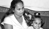 Disna, wife of sub-inspector Badujeewa Bopitigoda who has been in LTTE custody for some 11 months with her daughter Devni