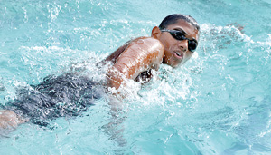 B.D.C. Dharmapriya of Trinity College winner of the Under 13 Boys 50m Freestyle junior event in action. - Pic by Ranjith Perera