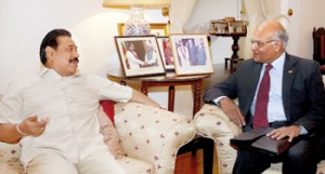 President Mahinda Rajapaksa in conversation with India’s National Security Advisor Shiv Shankar Menon