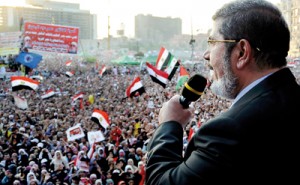 Egypt's Islamist President-elect Mohamed Mursi delivers a speech in Cairo's Tahrir Square (REUTERS)