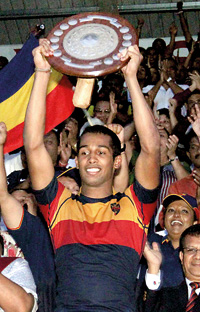 Kaneel Seneviratne, the Trinity skipper raises the Bradby Shield.