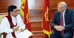 Economic Development Minister Basil Rajapaksa  in conversation with  India’s National Security Advisor Shiv Shankar Menon