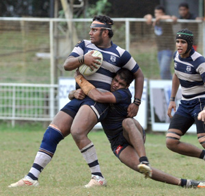 Josephian skipper Yohan Keyzer is not yielded by the tackle of Thomian Naheel Zainudeen at Longdon Place yesterday.  – Pic by Ranjith Perera