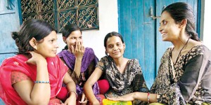 Rama Devi shows women in Dungra Jogi the tampons