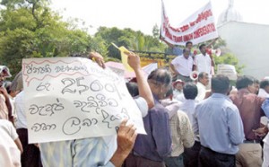 File photo  shows  trade union groups holding a pre-budget protest at Lipton’s Circus last year. Pix by Nilan Maligaspe