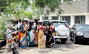 People waiting outside the Secretariat in Ampara for job interviews