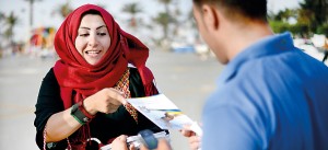 Libyan Justice and Construction supporters distribute and explain party leaflets during a Libyan National Assembly Campaign rally at Martyrs Square. AFP