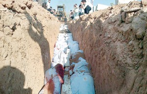 Upsetting: This image released by the Syrian opposition's Shaam News Network shows the mass burial of people allegedly killed by Syrian government forces in Douma