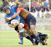 A Navy player is tackled by an Up Country Lions player. - - Pic by Amila Gamage