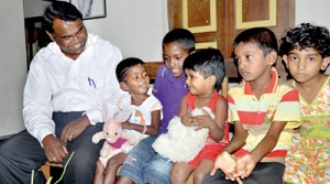 Happy in their new home: Brother and sister with other children at the SOS village