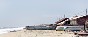 The boats lie anchored but with over a 1,000 men leaving the village illegally, there are only a few men left to go to sea