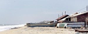 The boats lie anchored but with over a 1,000 men leaving the village illegally, there are only a few men left to go to sea