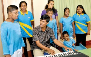 Music therapy: Nadun Hettiarachchi with his students.Pic by Susantha Liyanawatte