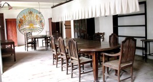 The dining room as it was in years gone by: The dining table with the pankha and the mural on the far wall. Pix by Indika Handuwala