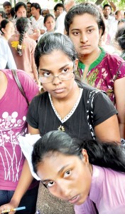 With anger and frustration writ large on their faces, these students, whose Z-score marks have come down after revision, arrive at the University Grants Commission office in Colombo hoping that there would be some solution to their plight. Please see Page 14 for detailed story. Pic by Mangala Weerasekera