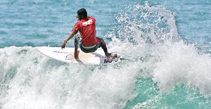 Asanka braving the waters at Arugam Bay