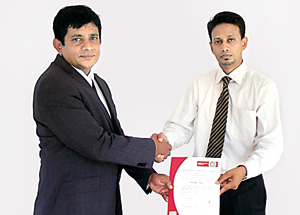 Picture shows Managing Director of Lanka Minerals & Chemicals M. U. Bopitiya (left) receiving the ISO certificate from Wasantha Gunarathne, Manager Country Business Development of Bureau Veritas Lanka (Pvt) Ltd.