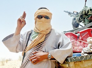 An Islamist rebel of Ansar Dine gestures near rebel-held Timbuktu in northern Mali. AFP