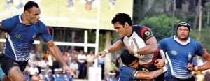 Kandy flyhalf Fazil Marija is well tackled by Navy fullback Reeza Mubarak. - Pic by Amila Gamage