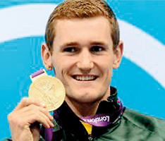 Cameron Van der Burgh poses on the podium after the men’s 100m breaststroke swimming event at the London Olympics. Van der Burgh, has admitted to cheating during his victory at the Olympics, which came in world-record time (AFP)