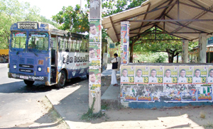 No place is too high or low when it comes to pasting posters as seen in these pictures  by K.G. Karunaratne in Polonnaruwa