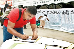Collecting signatures outside the Colombo Fort Railway Station.