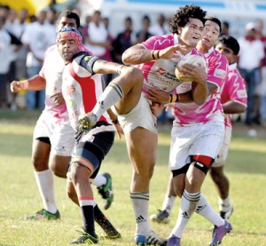 A Havelocks player is grabbed by a Kandy player with the Havelocks defence  moving into support - Pic by Ranjith Perera