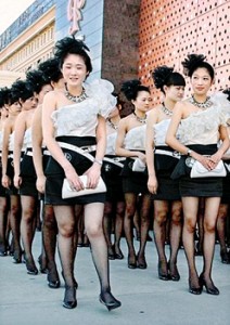 Dressing up: The waitresses arrived at the fire station in Wenling, Zhejiang province, wearing stiletto heels and full make-up
