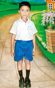 Against all odds:  Kavindu, the elder boy  is now studying   in Grade 2