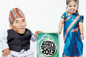 Standing tall: The world's smallest man, 72-year-old Chandra Dangi from Nepal meets Jyoti Amge, aged 18 from India, who is the shortest woman in the world as they launch the new edition of Guinness Book of Records