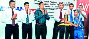 Under 13 winning captain, Harshan Yogendra of MCA Cricket Academy ‘Blues’ receiving the trophy from Sisira Pathmadeva,