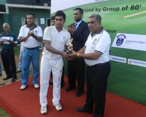 Nizky Ahmed of Zahira College receiving the best batsman’s award from Feroz Inham.