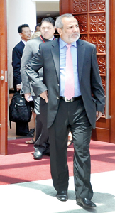 SLMC leader Rauff Hakeem who holds the key to the future of the Eastern Provincial Council and is being wooed by different parties is seenleaving a meeting of the Commonwealth Parliamentary Association. Pic by Indika Handuwela