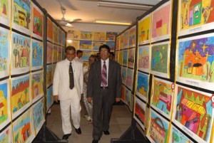 From left the principal Mr. D.M.D. Dissanayake with the chief guest Mr. Gotabhaya Jayarathna at the Art Gallery of the school.