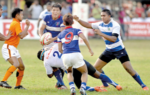 A Chinese Taipei player with the ball looks to make a break.  - Pic by Ranjith Perera