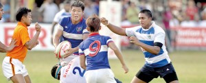 A Chinese Taipei player with the ball looks to make a break. - Pic by Ranjith Perera
