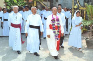 The Archbishop of Colombo, Malcolm Cardinal Ranjith being conducted into the School premises by the College Director, Reverend Doctor Leslie Fernando. The Principal Sister Mercy Fernando is seen in the background.