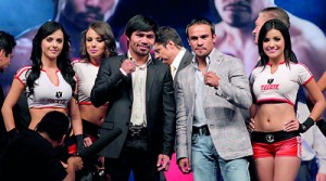 Manny Pacquiao of the Philippines (L) and Juan Manuel Marquez of Mexico pose ahead of their bout in Las Vegas at Mexico City Arena in Mexico City. Reuters.