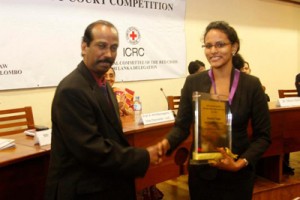 Dean of the Faculty of Law, University of Colombo, Mr V.T. Thamilmaran congratulates Lead Counsel of APIIT Law School team, Dilhara Gunaratne.— at Senate Room, College House, University of Colombo.