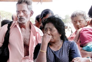 For more than three years these displaced people had lived in the safety and security of the Menik Farm at Chettikulam in Vavuniya. On Monday, they were told to leave for resettlement in other areas and the camp was closed down. Our picture shows one of the women breaking down in tears as she apparently wonders what awaits them in the future. Pic by Priyantha Hewage