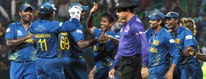 Sri Lankans celebrate Gayle’s wicket.