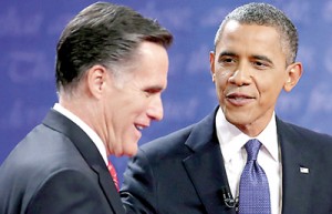 President Barack Obama (R) and his Republican contender Mitt Romney speak after the Presidential Debate at the University of Denver on October 3. AFP