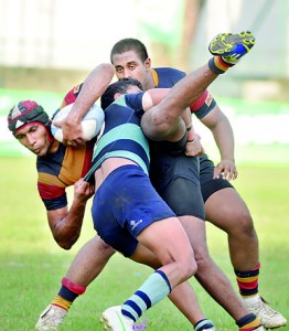 Trinity’s Randika de Alwis being countered by a Wesley defender. - Pic by Ranjith Perera.