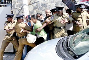 Parents try to block the principal’s vehicle entering the school