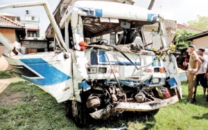 The bus and school van that were involved in a collision in Katubedda that left 11 people critically injured including seven schoolchildren. Pix by Reka Tharangani