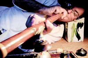 Anything for a hit: In this photo taken in mid 2007, Steven Martin smokes opium in the living room of his apartment in Chinatown in Bangkok opium habit