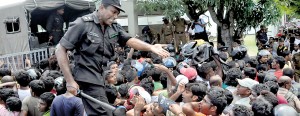 It’s a near stampede for tickets at the Sport Complex at Thurstan College as Cricket-crazy Lankans get news of the sale of 3,000 tickets. Pix by Indika Handuwala and Amila Gamage