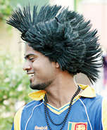Catch the wigs: A Lankan fan shows off his fancy headgear