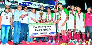 Skipper Mohamed Shazni along with his jubilant team members of Zahira Colombo  receiving the Zahira Super 16 championship trophy from the chief guest O.H. Sulaiman